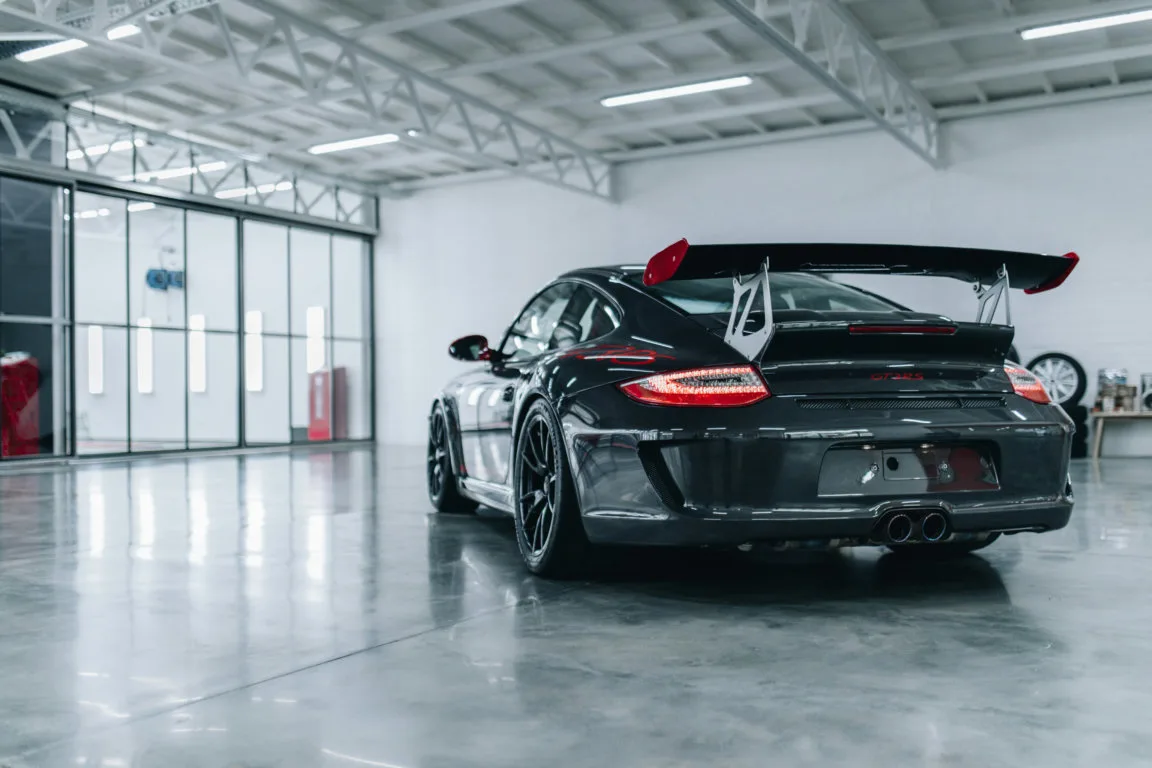 Black Porsche GT3 RS in a bright studio